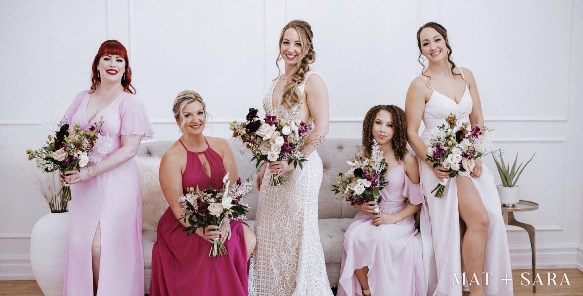 A bride and her bridesmaids in pink in the Bridal Suite